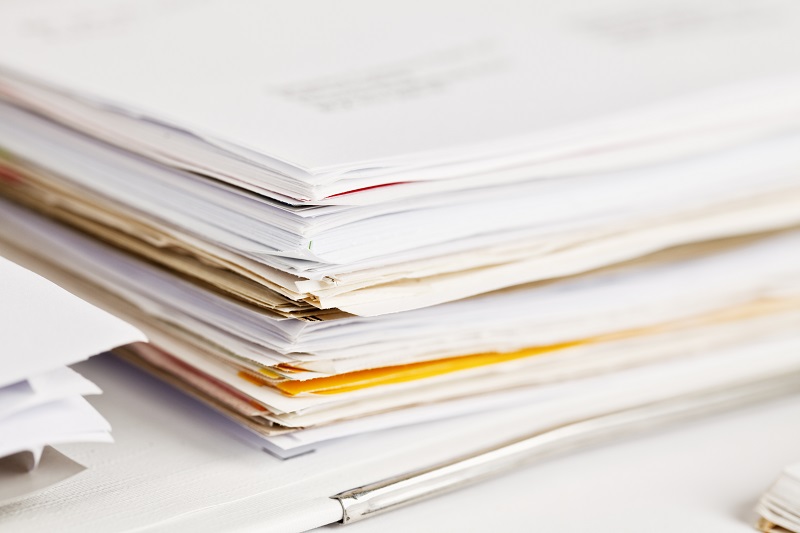detail of a stack of papers in a ring binder